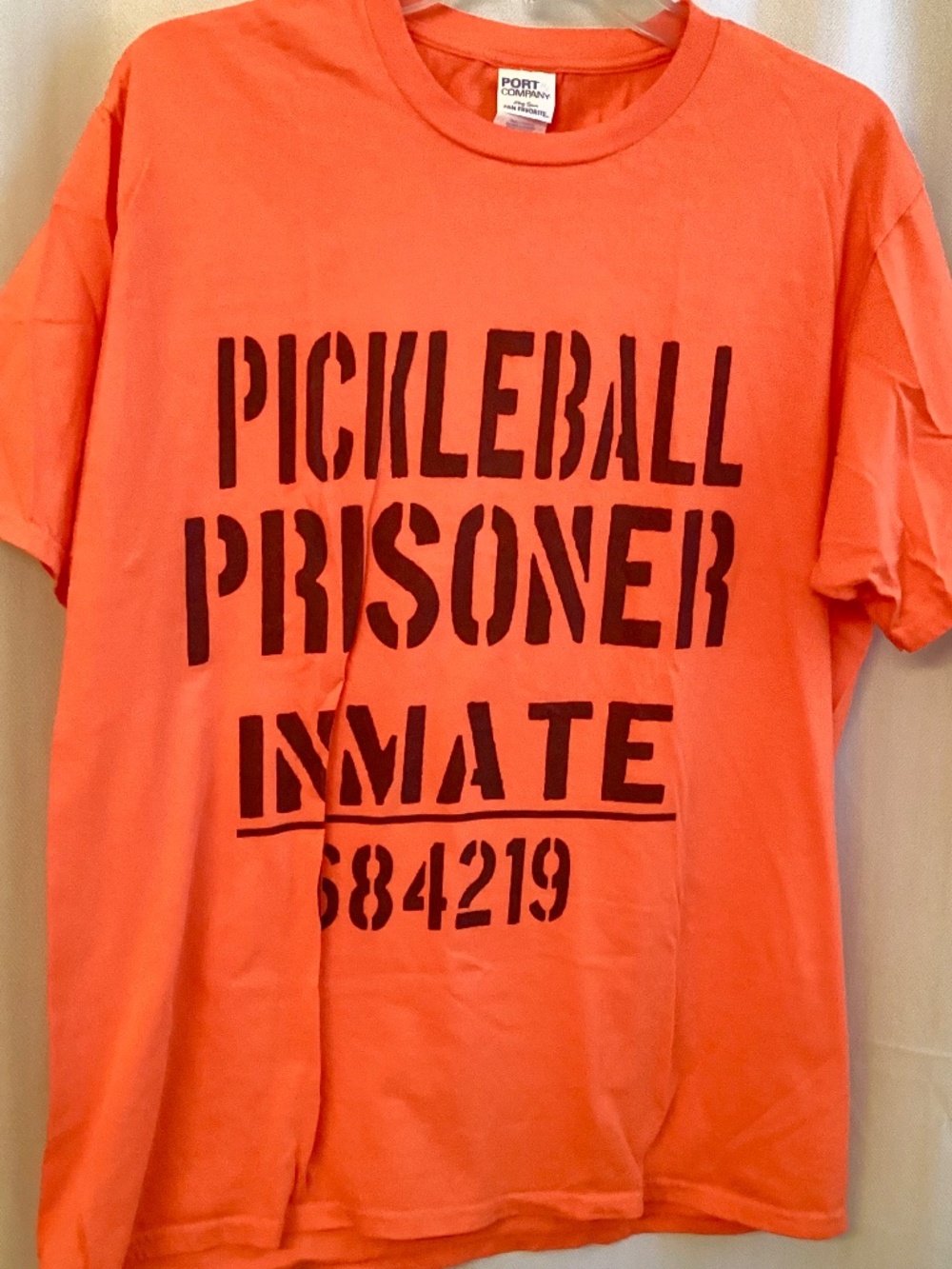 PORT & CO… Vibrant Orange PRISONER OF PICKLEBALL T-shirt… Size Lge.